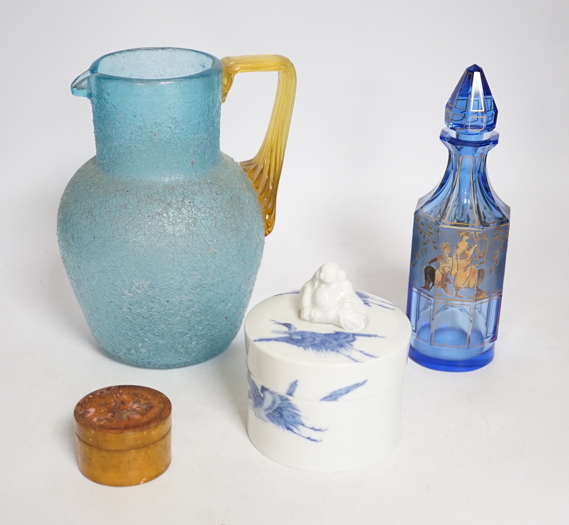 A 19th century Japanese Hirado blue and white cylindrical box and cover, height 8cms, a gold classically decorated glass bottle and a frosted glass jug and wooden pot (4)